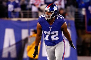 EAST RUTHERFORD, NJ - JANUARY 01:  Osi Umenyiora #72 of the New York Giants reacts after a tackle against the Dallas Cowboys at MetLife Stadium on January 1, 2012 in East Rutherford, New Jersey.  (Photo by Jeff Zelevansky/Getty Images)
