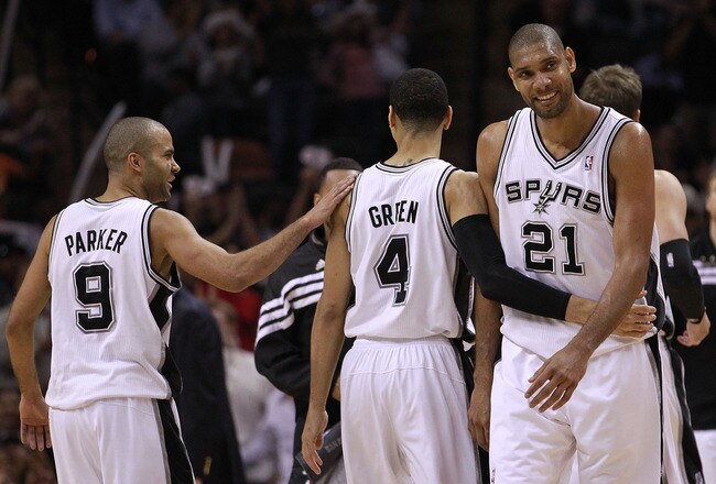 SAN ANTONIO, TX - MAY 17:  (L-R) Tony Parker #9, Daniel Green #4 and Tim Duncan #21 of the San Antonio Spurs celebrate during play against the Los Angeles Clippers in Game Two of the Western Conference Semifinals of the 2012 NBA Playoffs at AT&T Center on May 17, 2012 in San Antonio, Texas.  NOTE TO USER: User expressly acknowledges and agrees that, by downloading and or using this photograph, User is consenting to the terms and conditions of the Getty Images License Agreement.  (Photo by Ronald Martinez/Getty Images)