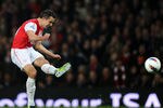 LONDON, ENGLAND - MARCH 12:   Robin van Persie of Arsenal takes a shot during the Barclays Premier League match between Arsenal and Newcastle United at Emirates Stadium on March 12, 2012 in London, England.  (Photo by Mike Hewitt/Getty Images)