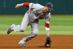 ST. PETERSBURG - MAY 16:  Infielder Dustin Pedroia #15 of the Boston Red Sox fields a ground ball against the Tampa Bay Rays during the game at Tropicana Field on May 16, 2012 in St. Petersburg, Florida.  (Photo by J. Meric/Getty Images)