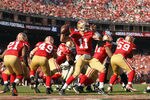 SAN FRANCISCO, CA - JANUARY 14:  Alex Smith #11 of the San Francisco 49ers looks to pass from the pocket in the first quarter against the New Orleans Saints during the NFC Divisional playoff game at Candlestick Park on January 14, 2012 in San Francisco, California.  (Photo by Ezra Shaw/Getty Images)