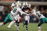 ARLINGTON, TX - NOVEMBER 24:   DeMarco Murray #29 of the Dallas Cowboys runs the ball against Kevin Burnett #56 and Sean Smith #24 of the Miami Dolphins during the Thanksgiving Day game at Cowboys Stadium on November 24, 2011 in Arlington, Texas.  (Photo by Ronald Martinez/Getty Images)