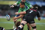 DURBAN, SOUTH AFRICA - MAY 05:  Hosea Gear with a off load as he is tackled by Marcell Coetzee during the Super Rugby match between Sharks and Highlanders from Mr Price Kings Park on May 05, 2012 in Durban, South Africa.  (Photo by Steve Haag/Gallo Images/Getty Images)
