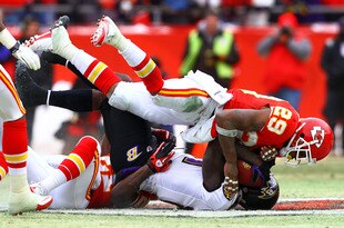 KANSAS CITY, MO - JANUARY 09:  Wide receiver Anquan Boldin #81 of the Baltimore Ravens is hit after a catch by safety Eric Berry #29 of the Kansas City Chiefs in the first half of their 2011 AFC wild card playoff game at Arrowhead Stadium on January 9, 2011 in Kansas City, Missouri.  (Photo by Dilip Vishwanat/Getty Images)