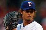 ARLINGTON, TX - APRIL 24:  Yu Darvish #11 of the Texas Rangers throws against the New York Yankees at Rangers Ballpark in Arlington on April 24, 2012 in Arlington, Texas.  (Photo by Ronald Martinez/Getty Images)