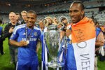 MUNICH, GERMANY - MAY 19:  Didier Drogba (R) and  Florent Malouda of Chelsea celebrate with the trophy after their victory in the UEFA Champions League Final between FC Bayern Muenchen and Chelsea at the Fussball Arena München on May 19, 2012 in Munich, Germany.  (Photo by Alex Livesey/Getty Images)
