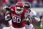 LITTLE ROCK, AR - NOVEMBER 19:   Chris Gragg #80 of the Arkansas Razorbacks runs the ball after catching a pass against the Mississippi State Bulldogs at War Memorial Stadium on November 19, 2011 in Little Rock, Arkansas.  (Photo by Wesley Hitt/Getty Images)