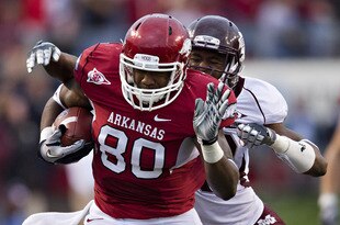 LITTLE ROCK, AR - NOVEMBER 19:   Chris Gragg #80 of the Arkansas Razorbacks runs the ball after catching a pass against the Mississippi State Bulldogs at War Memorial Stadium on November 19, 2011 in Little Rock, Arkansas.  (Photo by Wesley Hitt/Getty Images)