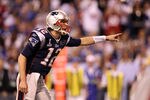 INDIANAPOLIS, IN - FEBRUARY 05:  Quarterback Tom Brady #12 of the New England Patriots reacts while taking on the New York Giants during Super Bowl XLVI at Lucas Oil Stadium on February 5, 2012 in Indianapolis, Indiana.  (Photo by Ezra Shaw/Getty Images)