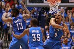 DALLAS, TX - MAY 05:  (L-R) James Harden #13, Kevin Durant #35 and Russell Westbrook #0 of the Oklahoma City Thunder celebrate after scoring with 10 seconds against the Dallas Mavericks during Game Four of the Western Conference Quarterfinals in the 2012 NBA Playoffs at American Airlines Center on May 5, 2012 in Dallas, Texas. NOTE TO USER: User expressly acknowledges and agrees that, by downloading and or using this photograph, User is consenting to the terms and conditions of the Getty Images License Agreement.  (Photo by Ronald Martinez/Getty Images)
