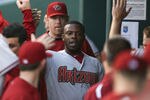 KANSAS CITY, MO - MAY 18:  Justin Upton #10 of the Arizona Diamondbacks is congratulated by teammates after scoring on a Miguel Montero double during a game against the Kansas City Royals at Kauffman Stadium May 18, 2012 in Kansas City, Missouri. (Photo by Ed Zurga/Getty Images)