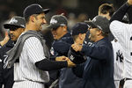 NEW YORK, NY - SEPTEMBER 21:  Jorge Posada #20 and hitting coach Kevin Long of the New York Yankees celebrate after clinching the American League East division against the Tampa Bay Rays on September 21, 2011 at Yankee Stadium in the Bronx borough of New York City.  (Photo by Jim McIsaac/Getty Images)