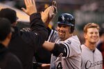 OAKLAND, CA - APRIL 23:  Paul Konerko #14 of the Chicago White Sox is congtratulated by teammates after he hit a home run in the fourth inning of their game against the Oakland Athletics at O.co Coliseum on April 23, 2012 in Oakland, California.  (Photo by Ezra Shaw/Getty Images)