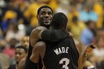 INDIANAPOLIS, IN - MAY 20:  LeBron James #6 of the Miami Heat hugs teammate Dwyane Wade #3 near the end of a win over the Indiana Pacers in Game Four of the Eastern Conference Semifinals in the 2012 NBA Playoffs at Bankers Life Fieldhouse on May 20, 2012 in Indianapolis, Indiana. The Heat defeated the Pacers 101-93. NOTE TO USER: User expressly acknowledges and agrees that, by downloading and/or using this photograph, User is consenting to the terms and conditions of the Getty Images License Agreement.  (Photo by Jonathan Daniel/Getty Images)