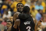 INDIANAPOLIS, IN - MAY 20:  LeBron James #6 of the Miami Heat hugs teammate Dwyane Wade #3 near the end of a win over the Indiana Pacers in Game Four of the Eastern Conference Semifinals in the 2012 NBA Playoffs at Bankers Life Fieldhouse on May 20, 2012 in Indianapolis, Indiana. The Heat defeated the Pacers 101-93. NOTE TO USER: User expressly acknowledges and agrees that, by downloading and/or using this photograph, User is consenting to the terms and conditions of the Getty Images License Agreement.  (Photo by Jonathan Daniel/Getty Images)
