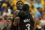 INDIANAPOLIS, IN - MAY 20:  LeBron James #6 of the Miami Heat hugs teammate Dwyane Wade #3 near the end of a win over the Indiana Pacers in Game Four of the Eastern Conference Semifinals in the 2012 NBA Playoffs at Bankers Life Fieldhouse on May 20, 2012 in Indianapolis, Indiana. The Heat defeated the Pacers 101-93. NOTE TO USER: User expressly acknowledges and agrees that, by downloading and/or using this photograph, User is consenting to the terms and conditions of the Getty Images License Agreement.  (Photo by Jonathan Daniel/Getty Images)