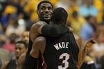 INDIANAPOLIS, IN - MAY 20:  LeBron James #6 of the Miami Heat hugs teammate Dwyane Wade #3 near the end of a win over the Indiana Pacers in Game Four of the Eastern Conference Semifinals in the 2012 NBA Playoffs at Bankers Life Fieldhouse on May 20, 2012 in Indianapolis, Indiana. The Heat defeated the Pacers 101-93. NOTE TO USER: User expressly acknowledges and agrees that, by downloading and/or using this photograph, User is consenting to the terms and conditions of the Getty Images License Agreement.  (Photo by Jonathan Daniel/Getty Images)