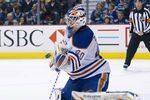 VANCOUVER, CANADA - APRIL 7: Goalie Devan Dubnyk #40 of the Edmonton Oilers makes a glove save against the Vancouver Canucks during the second period in NHL action on April 07, 2012 at Rogers Arena in Vancouver, British Columbia, Canada.  (Photo by Rich Lam/Getty Images)