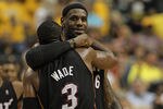 INDIANAPOLIS, IN - MAY 20:  LeBron James #6 of the Miami Heat hugs teammate Dwyane Wade #3 near the end of a win over the Indiana Pacers in Game Four of the Eastern Conference Semifinals in the 2012 NBA Playoffs at Bankers Life Fieldhouse on May 20, 2012 in Indianapolis, Indiana. The Heat defeated the Pacers 101-93. NOTE TO USER: User expressly acknowledges and agrees that, by downloading and/or using this photograph, User is consenting to the terms and conditions of the Getty Images License Agreement.  (Photo by Jonathan Daniel/Getty Images)