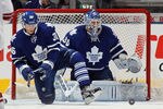 TORONTO, ON - NOVEMBER 15: Carl Gunnarsson #36 and Ben Scrivens #30 of the Toronto Maple Leafs guard the net against the Phoenix Coyotes at the Air Canada Centre on November 15, 2011 in Toronto, Ontario, Canada.  (Photo by Bruce Bennett/Getty Images)