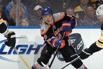 UNIONDALE, NY - MARCH 31: P.A. Parenteau #15 of the New York Islanders skates against the Boston Bruins at the Nassau Veterans Memorial Coliseum on March 31, 2012 in Uniondale, New York. The Bruins defeated the Islanders 6-3.  (Photo by Bruce Bennett/Getty Images)