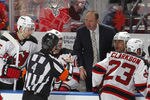 SUNRISE, FL - APRIL 21: Referee Wes McCauley #4 talks to head coach Peter DeBoer of the New Jersey Devils during a break in action against the Florida Panthers in Game Five of the Eastern Conference Quarterfinals during the 2012 NHL Stanley Cup Playoffs at the BankAtlantic Center on April 21, 2012  in Sunrise, Florida. The Panthers defeated the Devils 3-0. (Photo by Joel Auerbach/Getty Images)