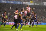 BILBAO, SPAIN - NOVEMBER 06:  Fernando Llorente of Athletic Club (C) heads the ball during the La Liga match between Athletic Club and FC Barcelona at San Mames Stadium on November 6, 2011 in Bilbao, Spain.  (Photo by David Ramos/Getty Images)