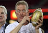 GLENDALE, AZ - JANUARY 02:  Interim head coach Bill Stewart of the West Virginia Mountaineers holds up the Fiesta Bowl trophy after the Mountaineers 48-28 victory against the Oklahoma Sooners at the Tostito's Fiesta Bowl at University of Phoenix Stadium January 2, 2008 in Glendale, Arizona.  (Photo by Stephen Dunn/Getty Images)