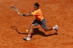 ROME, ITALY - MAY 21:  Rafael Nadal of Spain plays a backhand in his match against Novak Djokovic of Serbia in the final during day ten of the Internazionali BNL d'Italia 2012 Tennis on May 21, 2012 in Rome, Italy.  (Photo by Julian Finney/Getty Images)