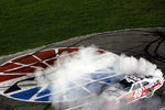 CHARLOTTE, NC - MAY 19:  Jimmie Johnson, driver of the #48 Lowe's Patriotic Chevrolet, celebrates with a burnout after winning the NASCAR Sprint All-Star Race at Charlotte Motor Speedway on May 19, 2012 in Charlotte, North Carolina.  (Photo by Streeter Lecka/Getty Images)