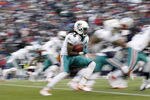 FOXBORO, MA - DECEMBER 24:  Clyde Gates #10 of the Miami Dolphins looks for an opening on a runback during the second half of New England's 27-24 win at Gillette Stadium on December 24, 2011 in Foxboro, Massachusetts.  (Photo by Winslow Townson/Getty Images)