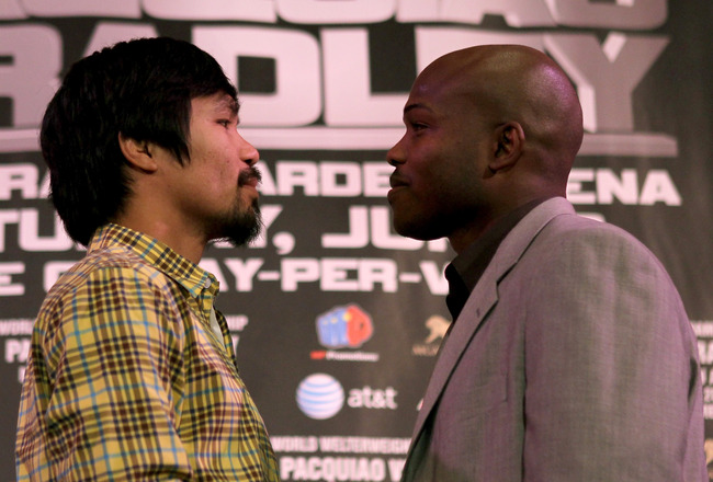 BEVERLY HILLS, CA - FEBRUARY 21:  Manny Pacquiao (L) and Timothy Bradley pose for photographers at a press conference announcing their upcoming World Boxing Organization welterweight championship fight at The Beverly Hills Hotel on February 21, 2012 in Beverly Hills, California.  (Photo by Stephen Dunn/Getty Images)