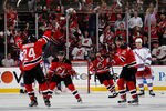 NEWARK, NJ - MAY 21:  Bryce Salvador #24 of the New Jersey Devils celebrates his first period goal with Jacob Josefson #16 and Alexei Ponikarovsky #12 as Derek Stepan #21 of the New York Rangers looks on in Game Four of the Eastern Conference Final during the 2012 NHL Stanley Cup Playoffs at the Prudential Center on May 21, 2012 in Newark, New Jersey.  (Photo by Bruce Bennett/Getty Images)