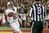 LOS ANGELES, CA - OCTOBER 29:  Quarterback Andrew Luck #12 of the Stanford Cardinal hands the ball to a referee after scoring on a two yard touchdown run in the third quarter against the USC Trojans at the Los Angeles Memorial Coliseum on October 29, 2011 in Los Angeles, California.  (Photo by Stephen Dunn/Getty Images)