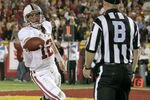 LOS ANGELES, CA - OCTOBER 29:  Quarterback Andrew Luck #12 of the Stanford Cardinal hands the ball to a referee after scoring on a two yard touchdown run in the third quarter against the USC Trojans at the Los Angeles Memorial Coliseum on October 29, 2011 in Los Angeles, California.  (Photo by Stephen Dunn/Getty Images)