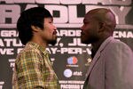 BEVERLY HILLS, CA - FEBRUARY 21:  Manny Pacquiao (L) and Timothy Bradley pose for photographers at a press conference announcing their upcoming World Boxing Organization welterweight championship fight at The Beverly Hills Hotel on February 21, 2012 in Beverly Hills, California.  (Photo by Stephen Dunn/Getty Images)