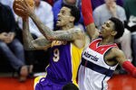 WASHINGTON, DC - MARCH 07: Matt Barnes #9 of the Los Angeles Lakers puts up a shot in front of Nick Young #1 of the Washington Wizards during the first half at the Verizon Center on March 7, 2012 in Washington, DC. NOTE TO USER: User expressly acknowledges and agrees that, by downloading and or using this photograph, User is consenting to the terms and conditions of the Getty Images License Agreement.  (Photo by Rob Carr/Getty Images)