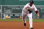 BOSTON, MA - MAY 12:  Adrian Gonzalez #28 of the Boston Red Sox chases a ground ball during a game with the Cleveland Indians at Fenway Park May 12, 2012  in Boston, Massachusetts. (Photo by Jim Rogash/Getty Images)