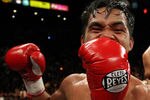 LAS VEGAS - DECEMBER 06:  Manny Pacquiao of the Philippines celebrates after defeating Oscar De La Hoya in the eighth round by TKO in their welterweight fight at the MGM Grand Garden Arena December 6, 2008 in Las Vegas, Nevada.  (Photo by Jed Jacobsohn/Getty Images)