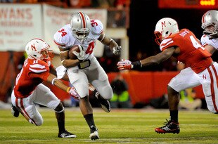LINCOLN, NE - OCTOBER 8: Running back Carlos Hyde #34 of the Ohio State Buckeyes runs past cornerback Andrew Green #11 of the Nebraska Cornhuskers and linebacker Lavonte David #4 of the Nebraska Cornhuskers during their game at Memorial Stadium October 8, 2011 in Lincoln, Nebraska. Nebraska Defeated Ohio State 34-27. (Photo by Eric Francis/Getty Images)