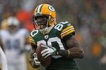 GREEN BAY, WI - JANUARY 01:  Donald Driver #80 of the Green Bay Packers reacts as he scores a touchdown against the Detroit Lions at Lambeau Field on January 1, 2012 in Green Bay, Wisconsin. The Packers defeated the Lions 45-41.  (Photo by Jonathan Daniel/Getty Images)