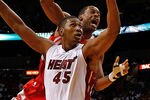 MIAMI, FL - APRIL 22: Marcus Camby #29 of the Houston Rockets is fouled by Dexter Pittman #45 of the Miami Heat during a game  at American Airlines Arena on April 22, 2012 in Miami, Florida. NOTE TO USER: User expressly acknowledges and agrees that, by downloading and/or using this Photograph, User is consenting to the terms and conditions of the Getty Images License Agreement.  (Photo by Mike Ehrmann/Getty Images)