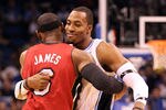 ORLANDO, FL - FEBRUARY 08:  LeBron James #6 of the Miami Heat hugs Dwight Howard #12 of the Orlando Magic during the game at Amway Center on February 8, 2012 in Orlando, Florida.   NOTE TO USER: User expressly acknowledges and agrees that, by downloading and or using this Photograph, user is consenting to the terms and conditions of the Getty Images License Agreement.  (Photo by Sam Greenwood/Getty Images)