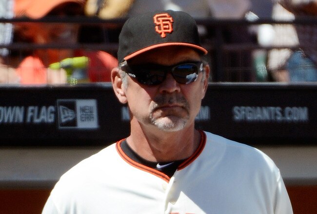 SAN FRANCISCO, CA - MAY 20:  Manager Bruce Bochy #15 of the San Francisco Giants looks on from the dugout in the fifth inning against the Oakland Athletics at AT&T Park on May 20, 2012 in San Francisco, California.  (Photo by Thearon W. Henderson/Getty Images)