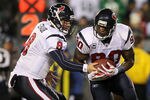 PHILADELPHIA, PA - DECEMBER 02:  Matt Schaub #8 of the Houston Texans hands the ball off to Andre Johnson #80 on  reverse against the Philadelphia Eagles at Lincoln Financial Field on December 2, 2010 in Philadelphia, Pennsylvania.  (Photo by Jim McIsaac/Getty Images)
