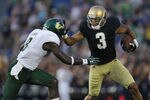 SOUTH BEND, IN - SEPTEMBER 03: Michael Floyd #3 of the Notre Dame Fighting Irish fights off  Jon Lejiste #8 of the University of South Florida Bulls at Notre Dame Stadium on September 3, 2011 in South Bend, Indiana. (Photo by Jonathan Daniel/Getty Images)