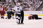 GLENDALE, AZ - MAY 22:  Dustin Brown #23 of the Los Angeles Kings reacts alongside a referee after Brown checked Michal Rozsival #32 of the Phoenix Coyotes in overtime of Game Five of the Western Conference Final during the 2012 NHL Stanley Cup Playoffs at Jobing.com Arena on May 22, 2012 in Phoenix, Arizona.  (Photo by Jeff Gross/Getty Images)