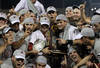 OMAHA, NE - JUNE 28:  (L-R) Brady Thomas #36 and Scott Wingo #8 of the South Carolina Gamecocks celebrate with the team while holding the trophy after winning the men's 2011 NCAA College Baseball World Series at TD Ameritrade Park Omaha on June 28, 2011 in Omaha, Nebraska.  The Gamecocks defeated the Florida Gators 5-2 and won the series 2-0.  (Photo by Ronald Martinez/Getty Images)
