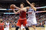 PHILADELPHIA, PA - MAY 10: Omer Asik #3 of the Chicago Bulls is fouled in the final seconds of the game by Spencer Hawes #00 of the Philadelphia 76ers in Game Six of the Eastern Conference Quarterfinals in the 2012 NBA Playoffs at the Wells Fargo Center on May 10, 2012 in Philadelphia, Pennsylvania. The 76ers won 79-78. NOTE TO USER: User expressly acknowledges and agrees that, by downloading and or using this photograph, User is consenting to the terms and conditions of the Getty Images License Agreement. (Photo by Drew Hallowell/Getty Images)