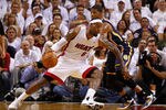 MIAMI, FL - MAY 22: LeBron James #6 of the Miami Heat posts up Paul George #24 of the Indiana Pacers during Game Five of the Eastern Conference Semifinals in the 2012 NBA Playoffs  at AmericanAirlines Arena on May 22, 2012 in Miami, Florida. NOTE TO USER: User expressly acknowledges and agrees that, by downloading and/or using this Photograph, User is consenting to the terms and conditions of the Getty Images License Agreement.  (Photo by Mike Ehrmann/Getty Images)
